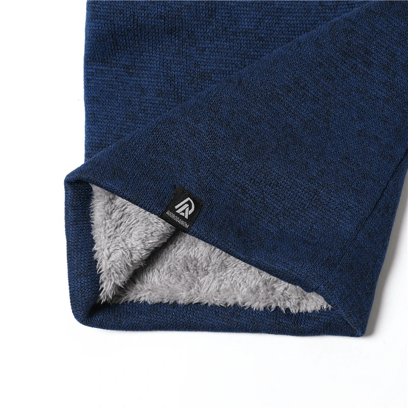 Soft blue fleece-lined knitted neck warmer with cozy gray interior, showcasing stylish design for winter comfort and fashion.